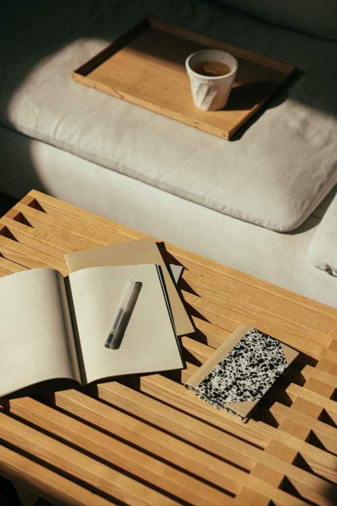 black and white book on brown wooden table