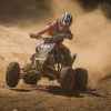 person riding on black atv quad bike